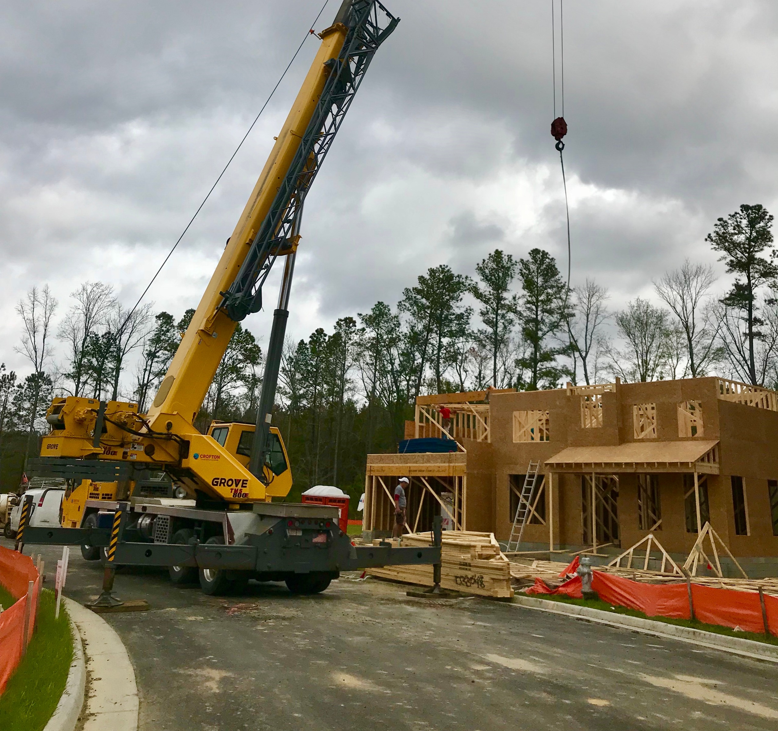 Crofton Crane Rental & Rigging's 80-ton Grove setting roof trusses.