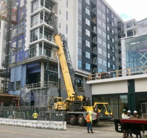 Crofton Crane Rental & Rigging's 90-ton Grove removes scaffolding in Virginia Beach.