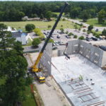 Crofton Crane Rental & Rigging's 300-ton Grove places tilt up panels in Chesapeake, VA.