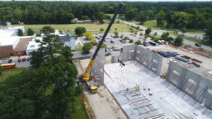 Crofton Crane Rental & Rigging's 300-ton Grove places tilt up panels in Chesapeake, VA.