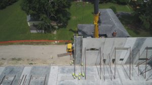 Crofton Crane Rental & Rigging's 300-ton Grove places tilt up panels in Chesapeake, VA.
