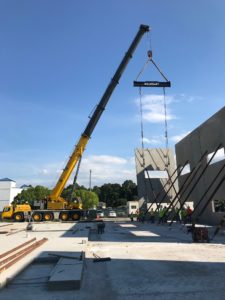 Crofton Crane Rental & Rigging's 300-ton Grove places tilt up panels in Chesapeake, VA.