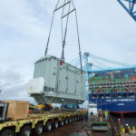 Crofton Crane Rental & Rigging's 350-ton floating derrick, The Samson, lifts 110-ton generator on to the Theodore Roosevelt.