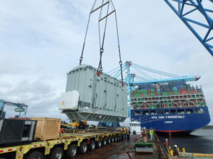 Crofton Crane Rental & Rigging's 350-ton floating derrick, The Samson, lifts 110-ton generator on to the Theodore Roosevelt.