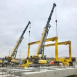 Crofton Crane Rental & Rigging's 90-ton and 110-ton hydraulic truck cranes perform tandem lift.