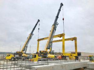 Crofton Crane Rental & Rigging's 90-ton and 110-ton hydraulic truck cranes perform tandem lift.