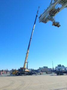 Crofton Crane Rental & Rigging's 110-ton Grove lifts cable reel with 215 of boom at Norfolk terminal.